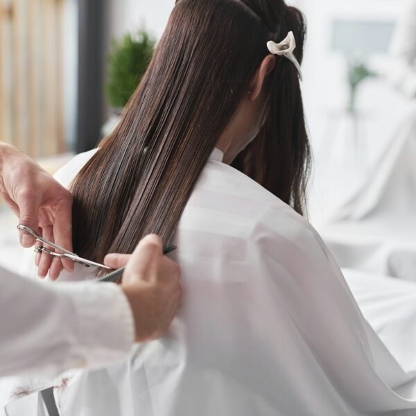 Close up of long hair cut by hairstylist